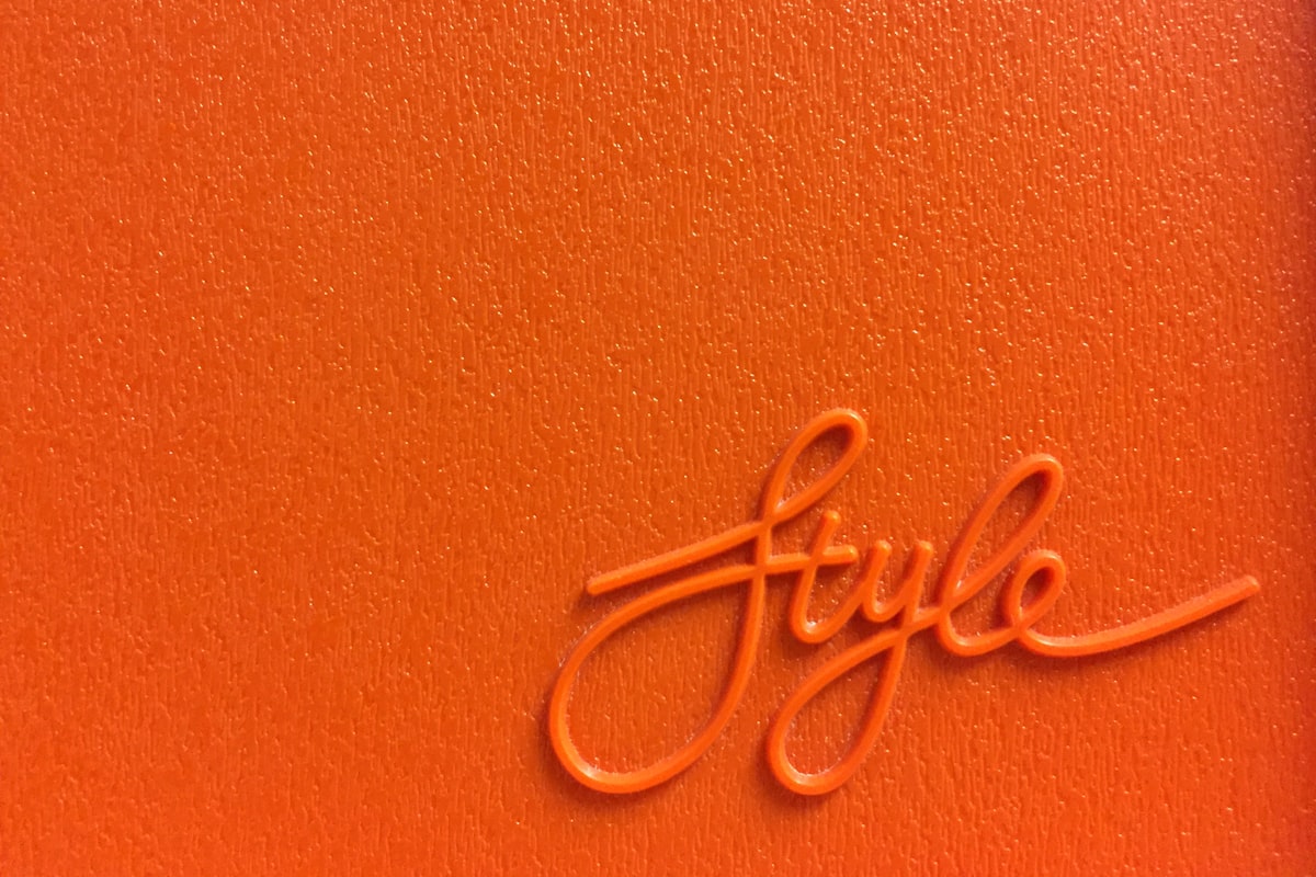 Orange Style lettering on a vintage plastic board related to 10 Fresh Ways to Style Your Home with Paisley Valance Curtains