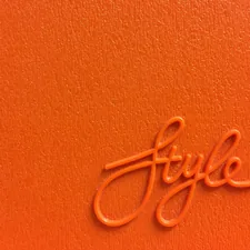 Orange Style lettering on a vintage plastic board related to 10 Fresh Ways to Style Your Home with Paisley Valance Curtains