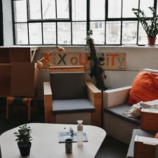 orange throw pillows on sofa armchairs near wooden wooden coffee table related to Elevate Your Space with the Waverly Williamsburg Valance: A Comprehensive Guide