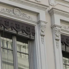 Ornate architectural detail on building windows. related to Elegant Waverly Valances and Swags: Enhance Your Windows with Class