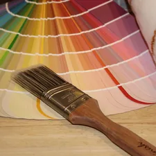 Paint fan and brush. Paint colors related to Welcoming Hues: The Ultimate Guide to Entryway Paint Colors