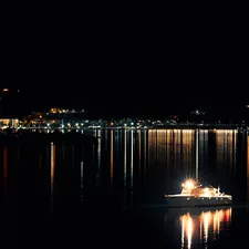 Patrol Ship Navigating San Diego Bay at Night related to Elegant Nights: Explore the Best Navy Blue Coverlets for Your Queen-Size Bed