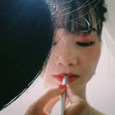 person applying lipstick on woman wearing wedding veil related to Warmth and Style: Unlocking the Beauty of Terracotta Chimineas