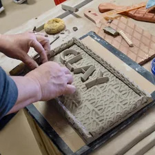 person doing cay related to Warm Up in Style: The Ultimate Guide to Chiminea Clay Outdoor Fireplace