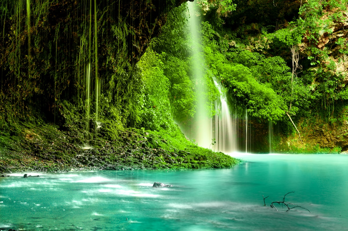 person in black jacket standing on body of water during daytime related to A Beginner's Guide to Sewing a Beautiful Waterfall Valance