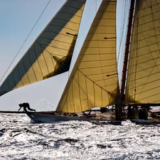 person in black shirt sitting on white sail boat during daytime related to Sail the Seas of Style with a Navy Coverlet for Your Queen Bed
