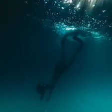 person underwater photo related to Reviving the Classics: A Deep Dive into the BMW E28 Front Valance