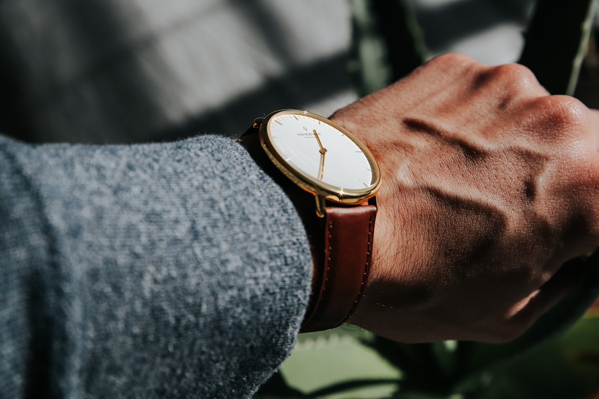 person wearing brown leather strap gold round analog watch related to Uncovering the Timeless Classic: The Man Who Shot Liberty Valance Blu Ray