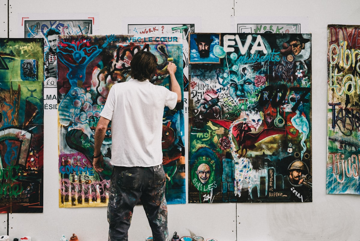 Person working on painting related to Elevating Your Space: The Art of Balloon Valance Patterns