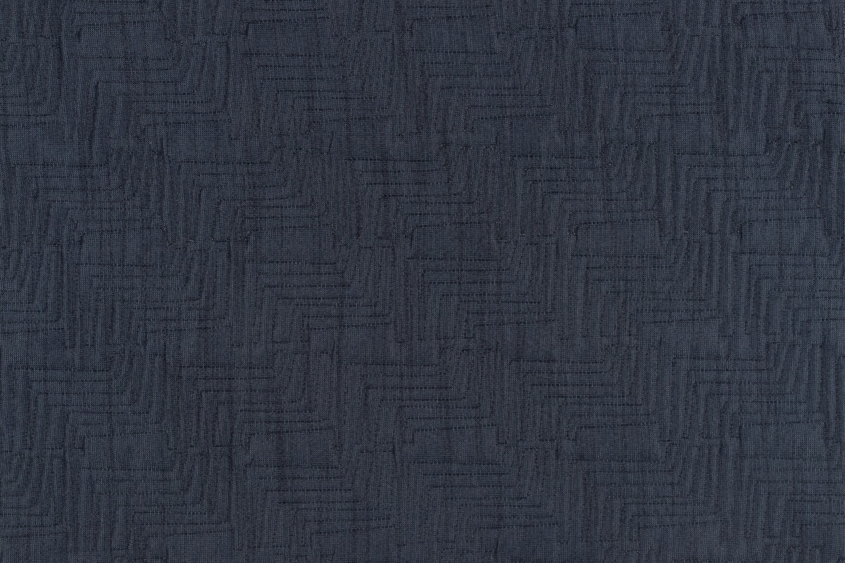 Photo of a dark navy colored fabric swatch with repeating Tetris block patterns. Perfect for computer and phone wallpapers.  related to Elegant Matelasse Coverlet King: Timeless Comfort and Style