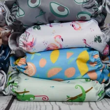 Piles of cloth diapers arranged on a plain background. related to King Size Coverlets on Sale
