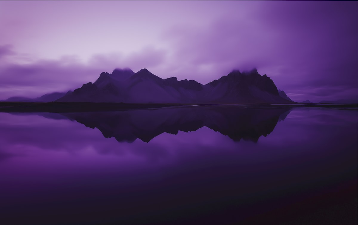 Purple mountains reflected in calm water related to Elegant Purple Valances to Enhance Your Bedroom Decor