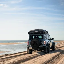 Quick drive down the beach on Assateague Island in our Ford Bronco related to Transform Your Living Space: Converting a Couch into a Sofa Bed