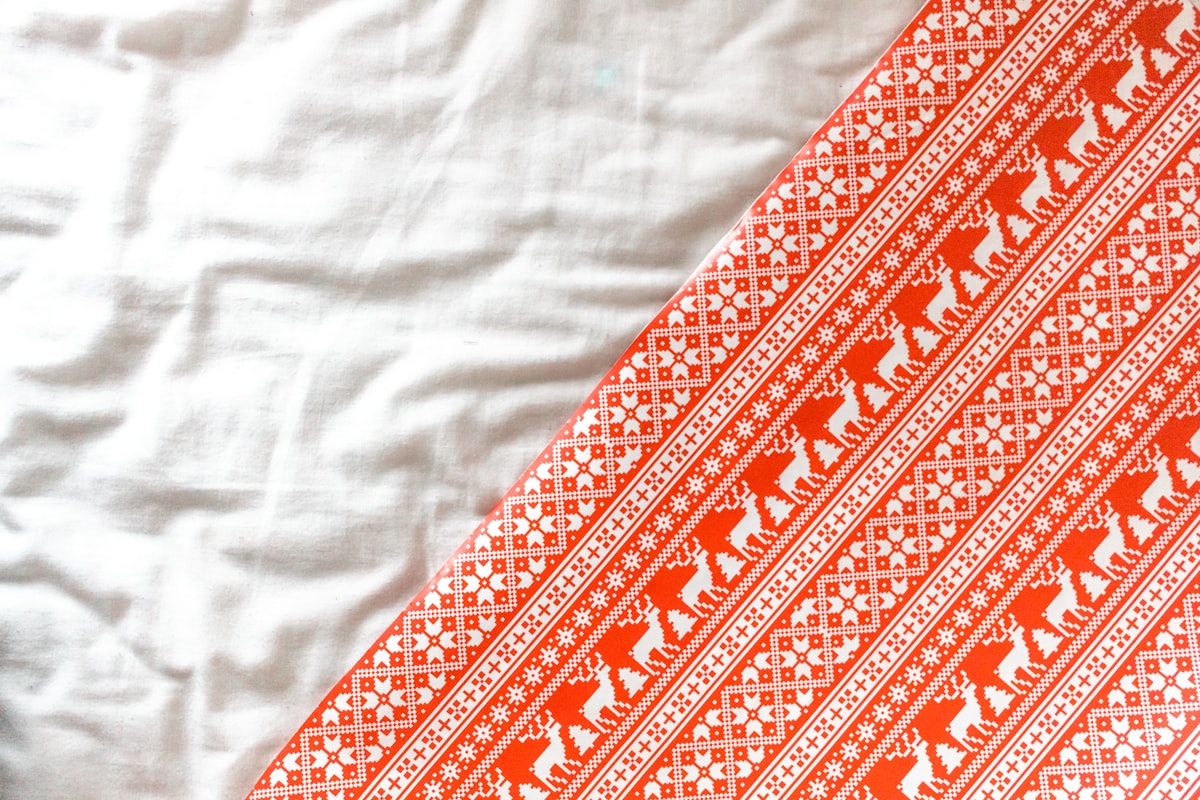 red and white floral textile related to Authentic Red Matelasse Coverlets for Warmth and Style