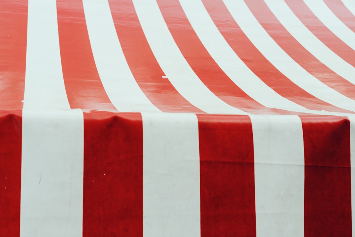 Red and white striped tent fabric related to Create Your Dream Retreat: A Step-by-Step Guide to Making a Canopy Bed