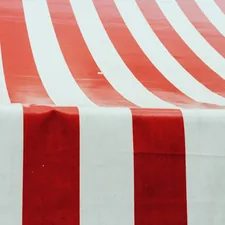 Red and white striped tent fabric related to Create Your Dream Retreat: A Step-by-Step Guide to Making a Canopy Bed