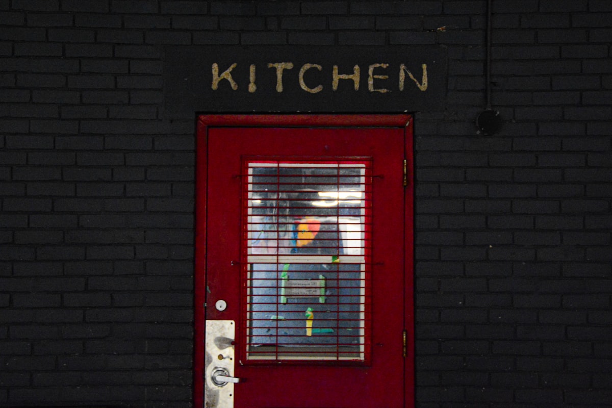 Red door black brick wall  related to Red Kitchen Valance: A Pop of Color for Your Kitchen