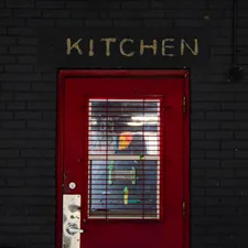 Red door black brick wall  related to Red Kitchen Valance: A Pop of Color for Your Kitchen