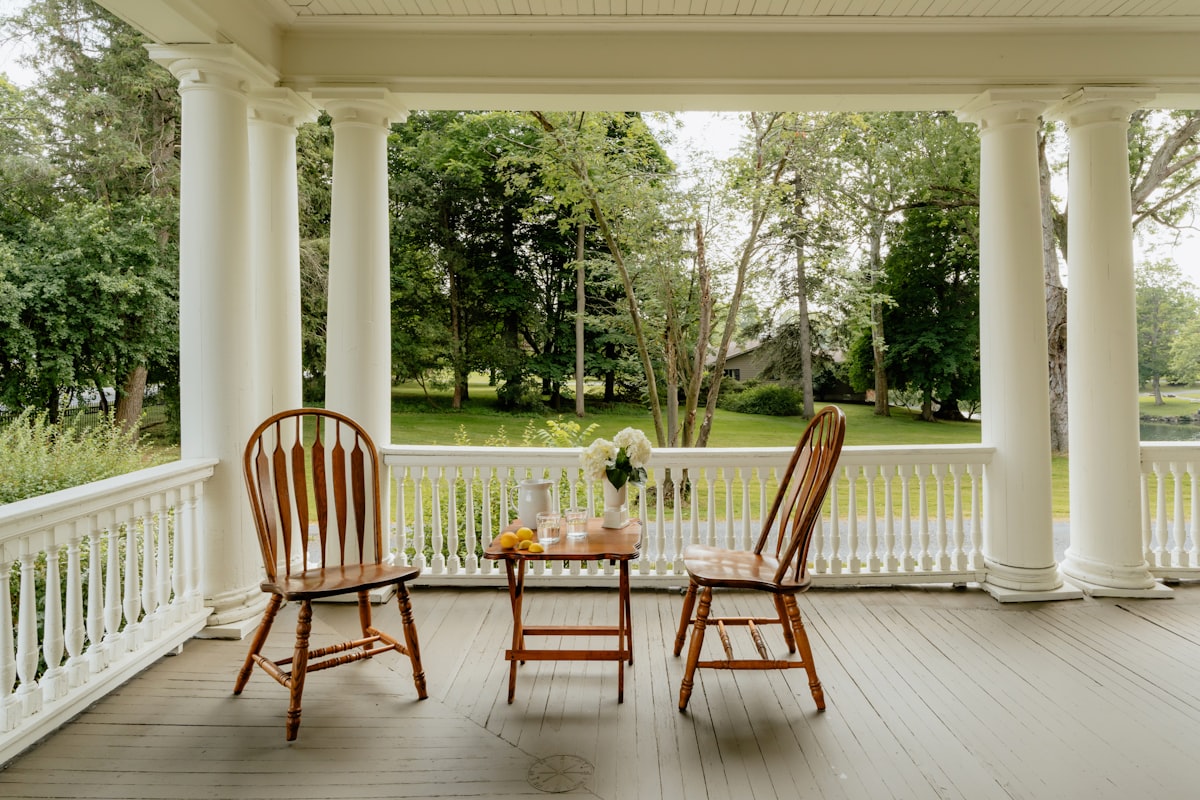Relaxing on the porch (IG: @clay.banks) related to Country Chic Window Treatments: Elevating Your Porch with Beautiful Valances