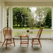 Relaxing on the porch (IG: @clay.banks) related to Country Chic Window Treatments: Elevating Your Porch with Beautiful Valances