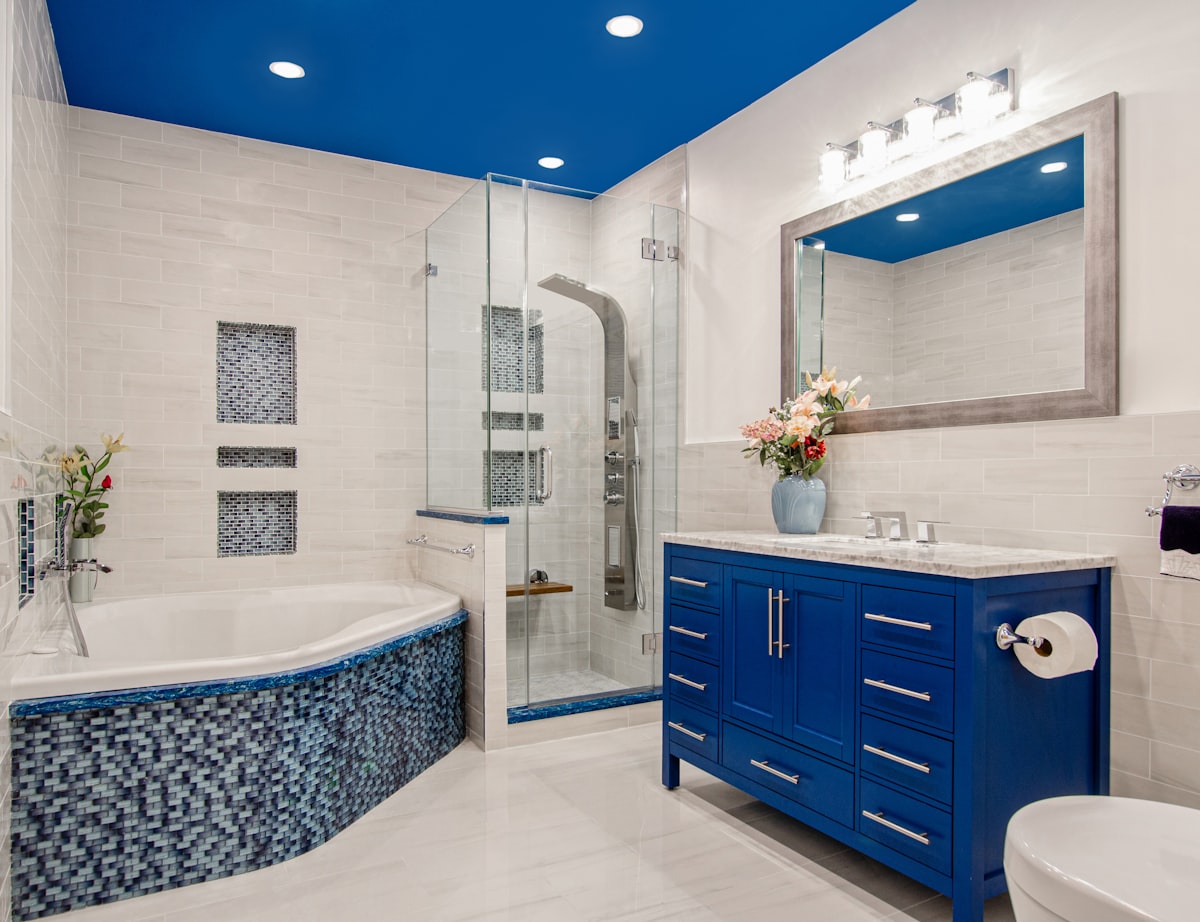 Renovated Brooklyn NY Bathroom. Blue bathroom. White Bathroom. Blue ceiling. Blue vanity. Blue tile. Jacuzzi tub. white tiles. stand up shower.  related to Elevate Your Bathroom with a Matching Shower Curtain and Window Valance