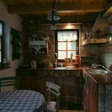 Rustic kitchen with checkered tablecloth and brick walls related to Country Kitchen Curtains & Valances