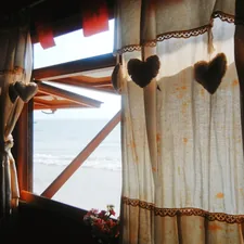 Rustic Window with Heart Curtains related to Country Curtain Valances for a Rustic Touch