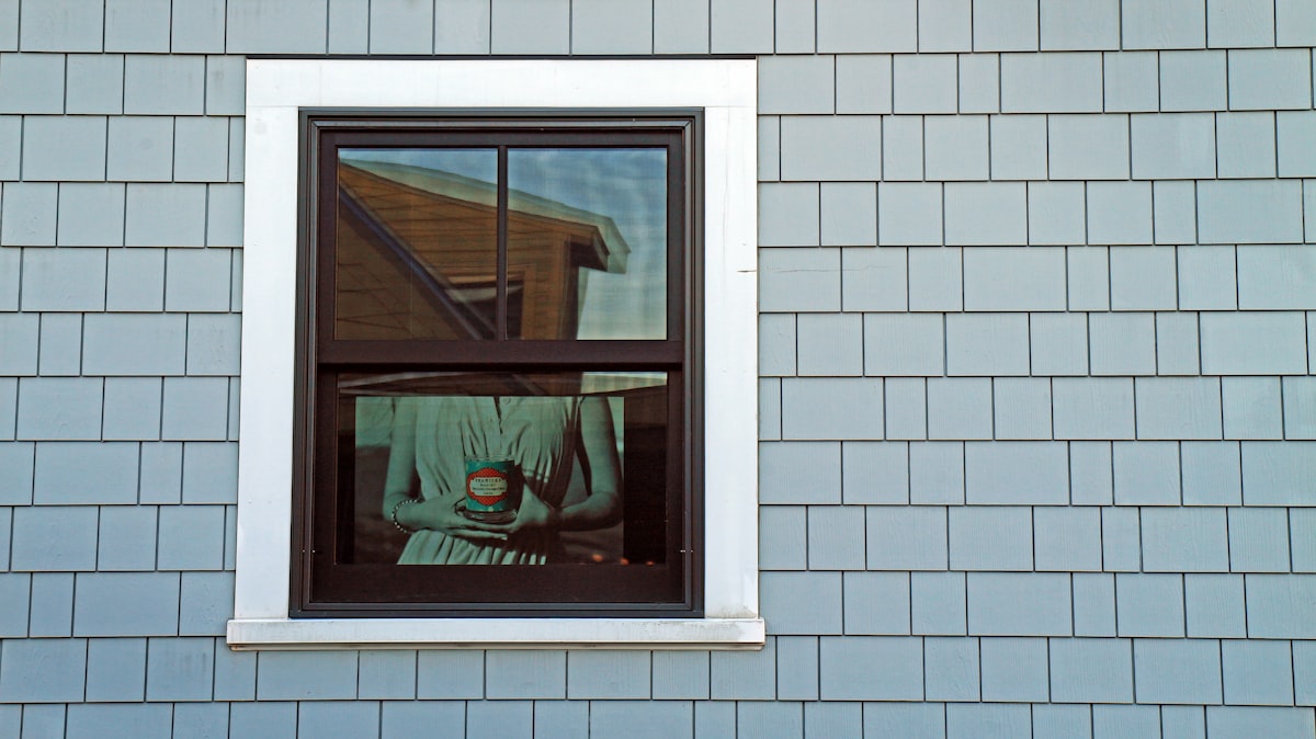 "Seawicks" --- An advertisement poster for Seawicks Candle Company in a window. related to Elevate Your Windows with Style: Pattern for Swag Valance