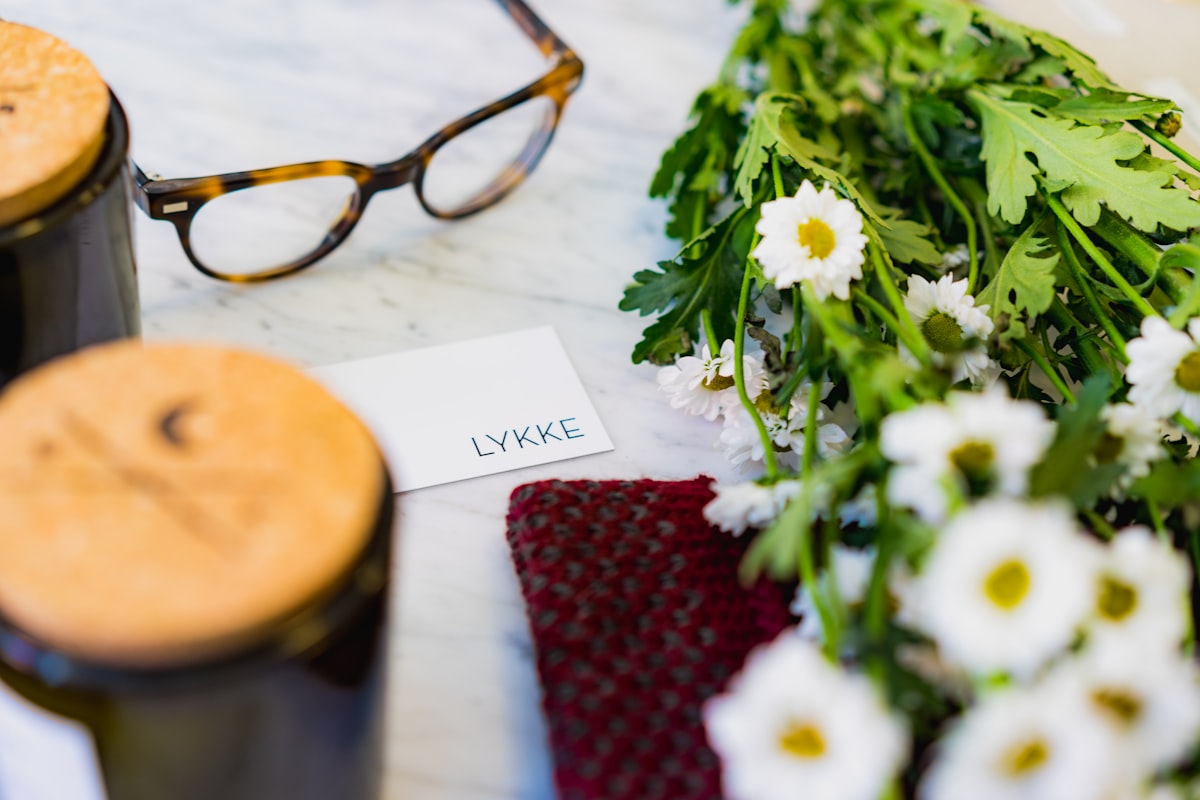 shallow focus photo of eyeglasses beside flower related to Elevate Your Style with Floral Valances for Windows