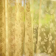 Sheer curtains softly filter the sunlight. related to Lace Curtain Panels with Attached Valance