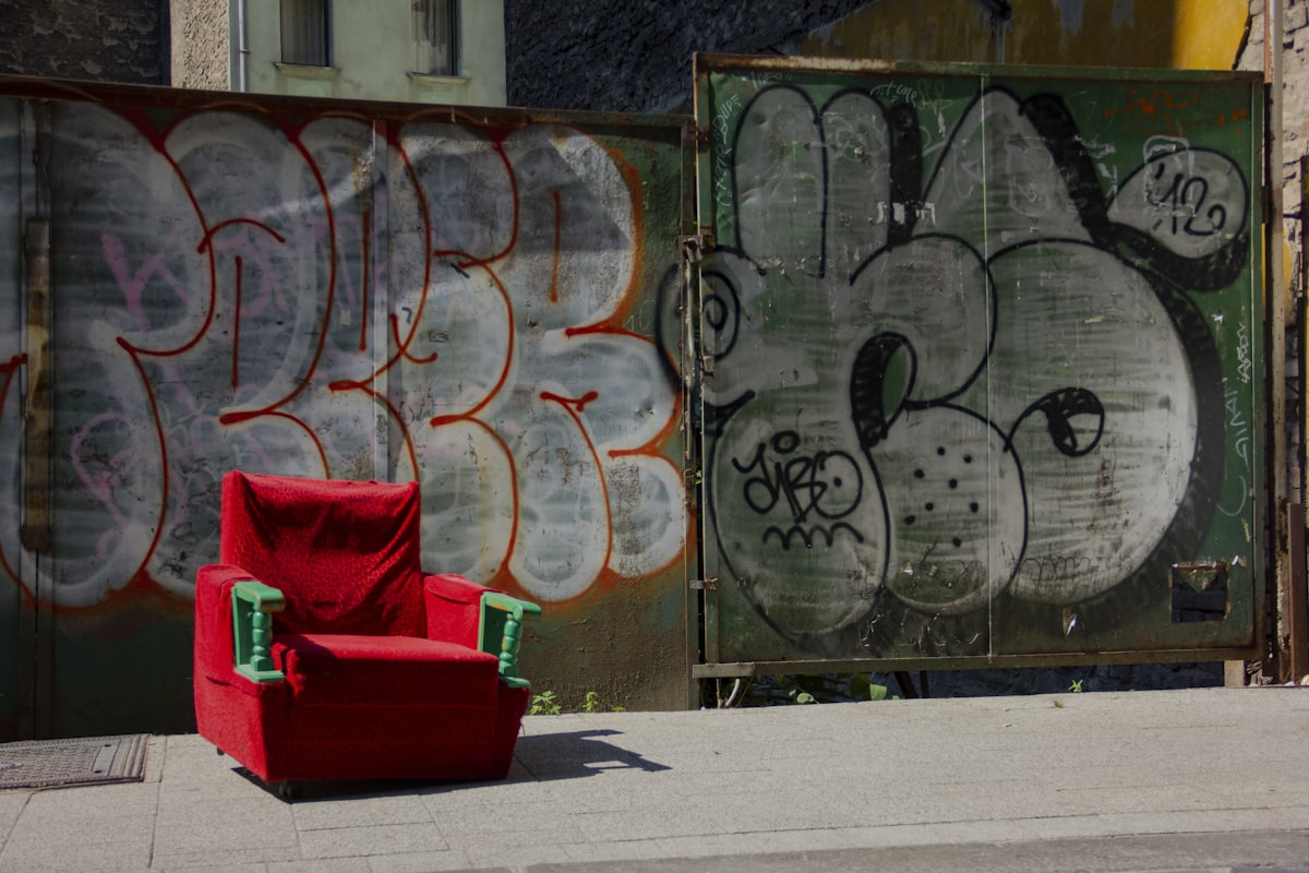 Side street in Budapest in 2015, with chair and wall of graffiti. related to The Ultimate Space Saver: Foam Chair Fold Out Bed