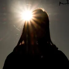 silhouette of person standing during daytime related to Bring Sunshine into Your Home: Stylish Yellow Valances for Windows