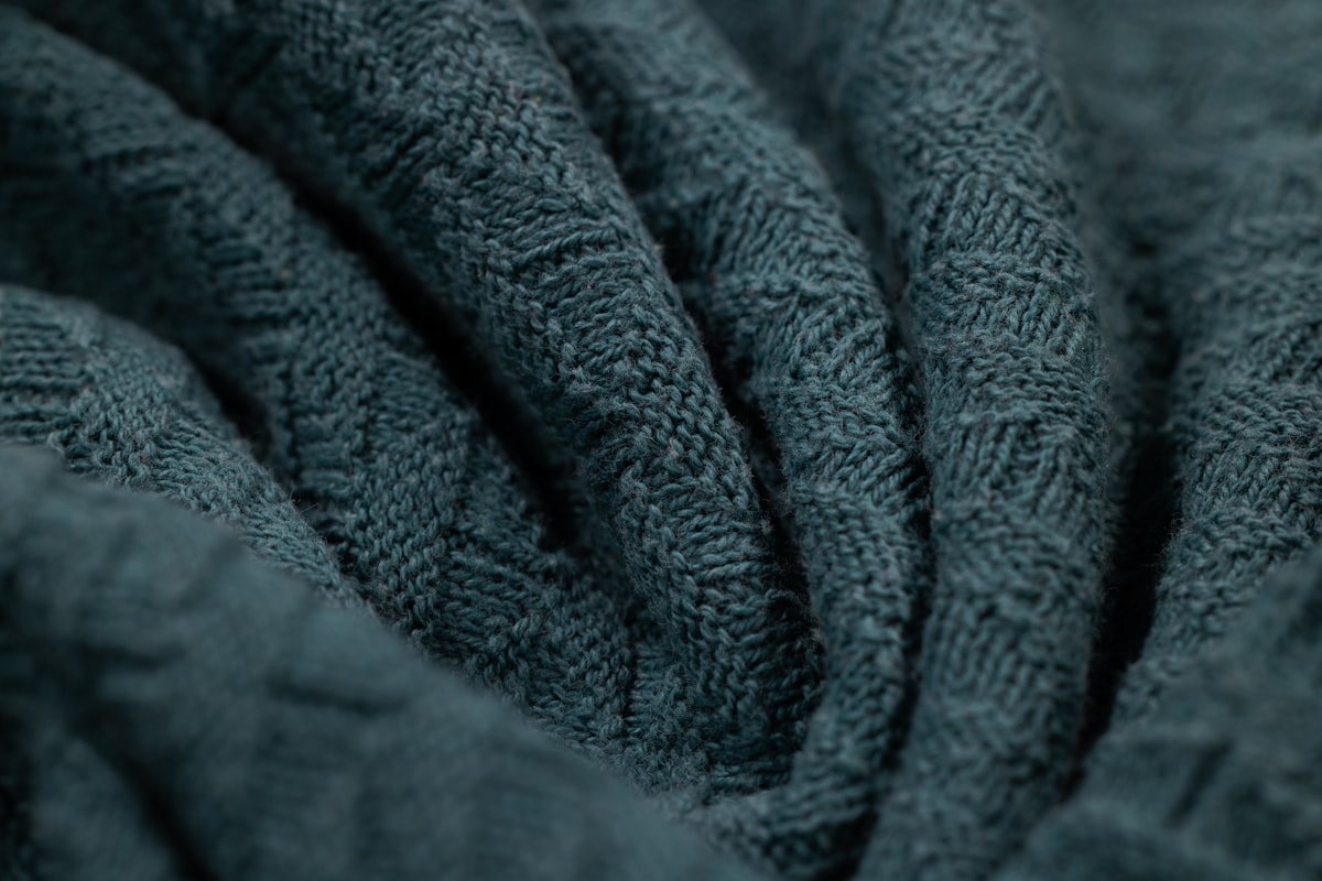 Soft fabric texture close up related to Cable Knit Coverlet | Snuggle in Sophisticated Style