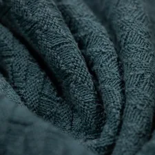 Soft fabric texture close up related to Cable Knit Coverlet | Snuggle in Sophisticated Style