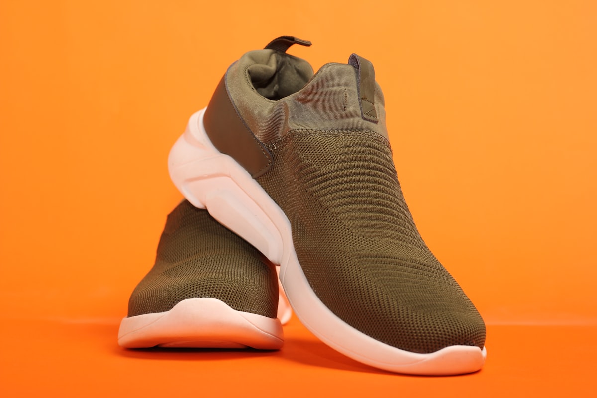 Sport shoes with orange background. related to Explore Comfortable and Stylish Full Size Beds