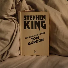 Stephen king book rests on rumpled sheets. related to Ethan Allen King Beds: The Ultimate Sleep Experience