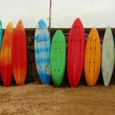 Surfboards propped against a wall. related to Fully Assembled Sideboards: Elevate Your Home Decor with Convenience