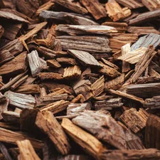Tapis naturel d’écorces de bois en gros plan, révélant textures rugueuses et teintes chaleureuses. Idéal pour fond d’écran ou usage graphique. related to Creating a Perfect Landscape with Mulch Bed Edgers