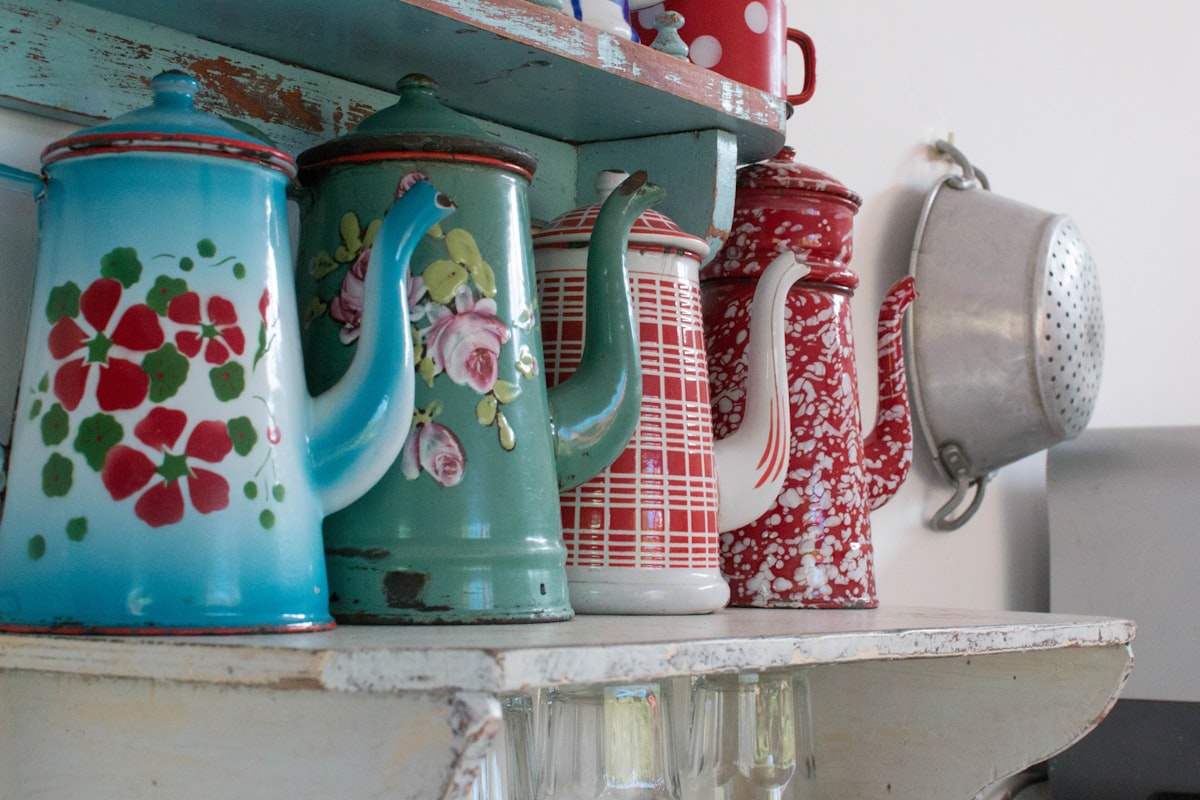 Tea pots on the shelf in the kitchen.  related to Retro Kitchen Valances