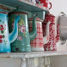 Tea pots on the shelf in the kitchen.  related to Retro Kitchen Valances