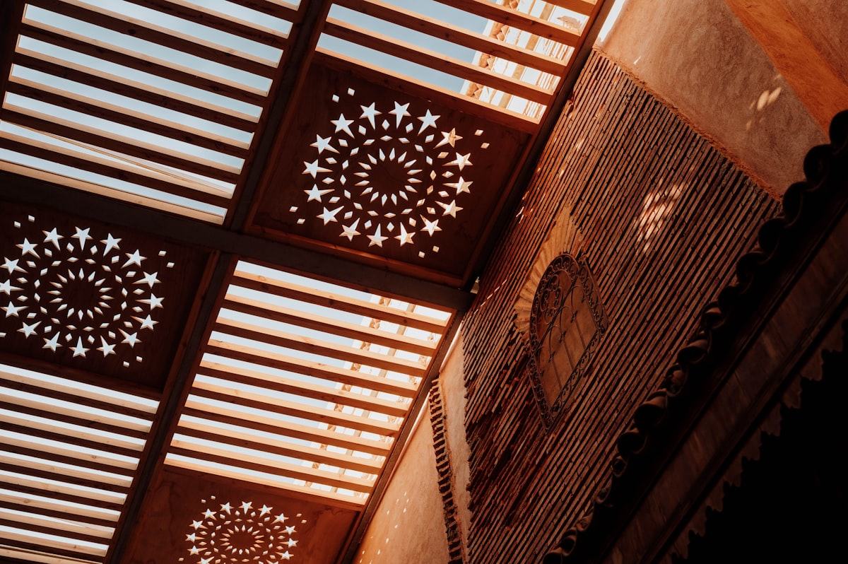 the ceiling of a building has intricate designs on it related to Wooden Valance Designs