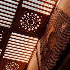 the ceiling of a building has intricate designs on it related to Wooden Valance Designs