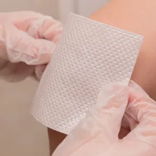 The doctor seals the wound to the patient. Vaccine. Wound. The medicine. Place for an inscription. Advertising. related to Coverlet Adhesive Dressing: Your Wound Care Solution