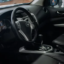 the interior of a car with a steering wheel and dashboard related to Enhance Your Nissan Frontier with the Right Bed Cover
