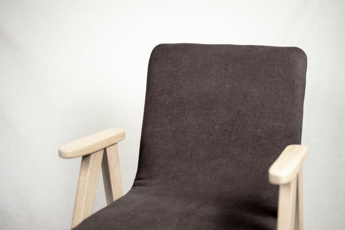 The wood chair with white background related to The Ultimate Guide to Recliner Bed Chairs: Comfort and Functionality Combined