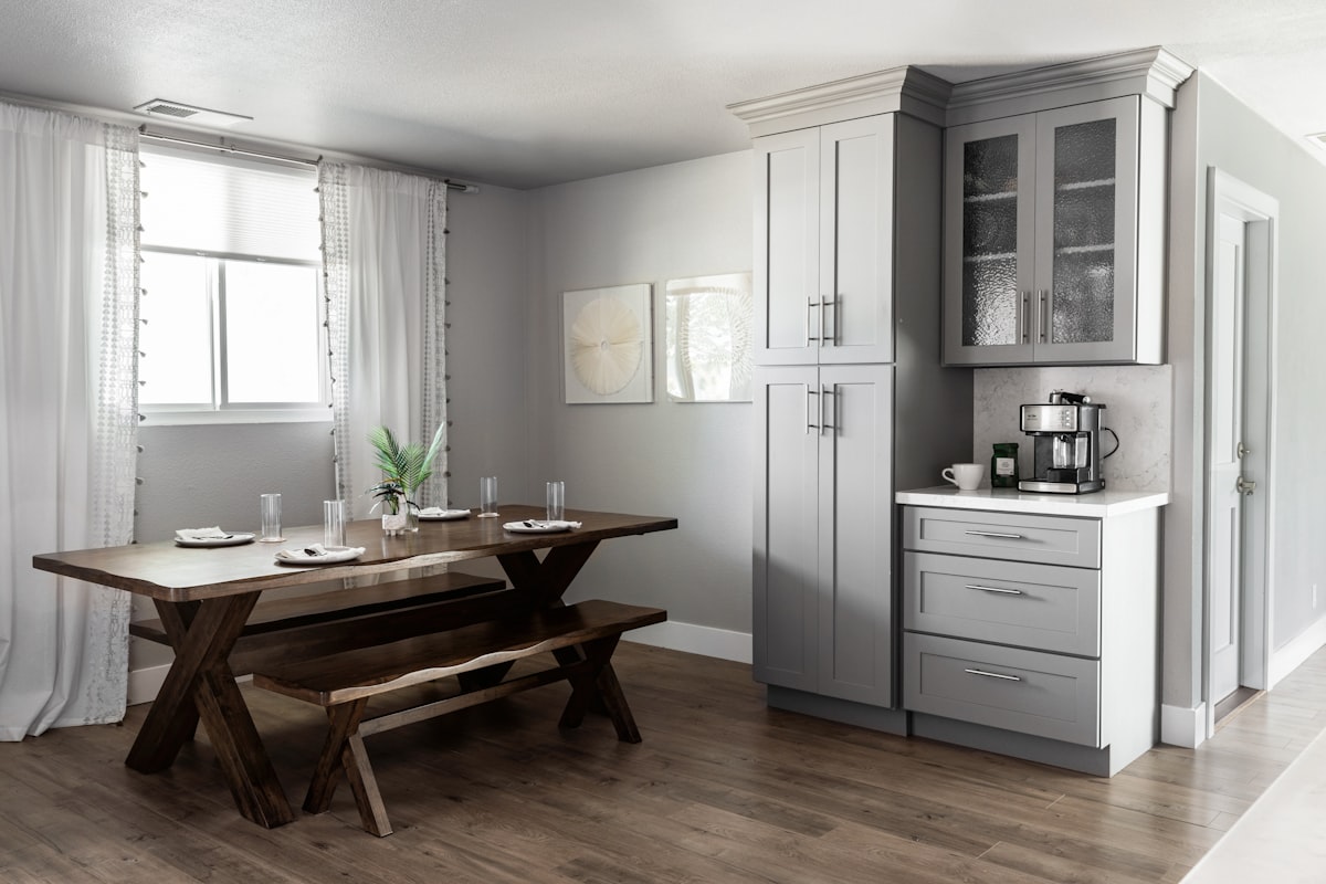 This charming space features a side kitchen table, perfect for quick meals. The stylish cupboard adds a touch of elegance related to Choosing the Perfect Kitchen Sideboard with Hutch for Your Home