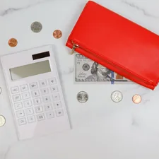 This feminine styled stock photo features money, cash, and coins and is perfect for business, accounting, or personal finance content. related to Score Big Savings: Your Guide to Bed Bath & Beyond Promo Codes