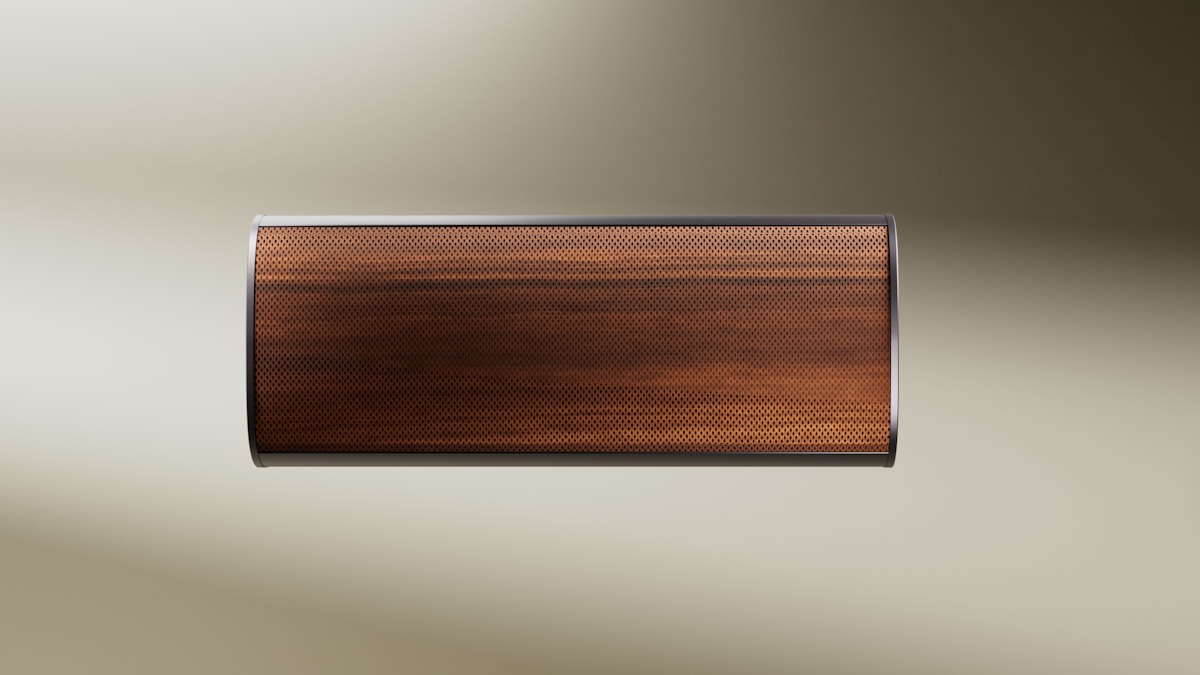 This image features a premium portable speaker with a refined and minimalist design, highlighted by a warm, wood-textured grille and sleek metallic edges, presented against a soft gradient background to emphasize its modern sophistication and timeless aesthetic. related to Wood Valance Ideas