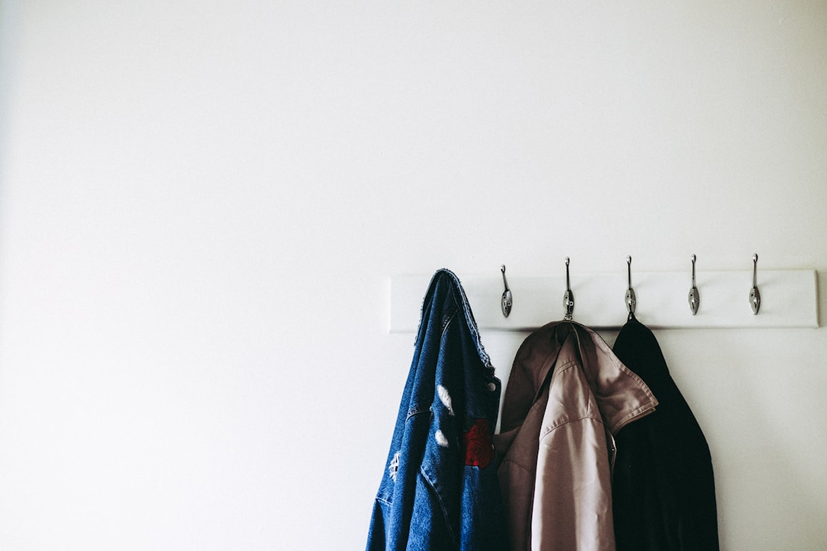 three jacket hanging on wall hooks related to Securely Hang Your Valances with Reliable Replacement Clips