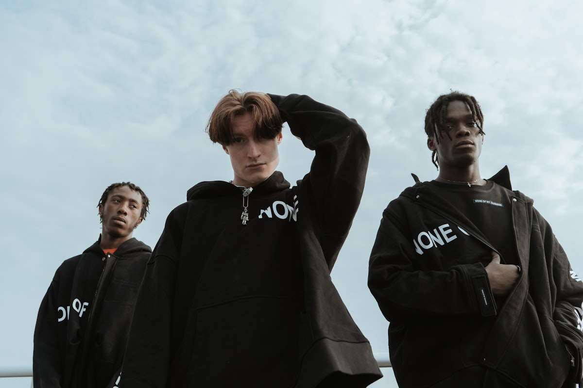 three men standing outdoors related to Off White Coverlets